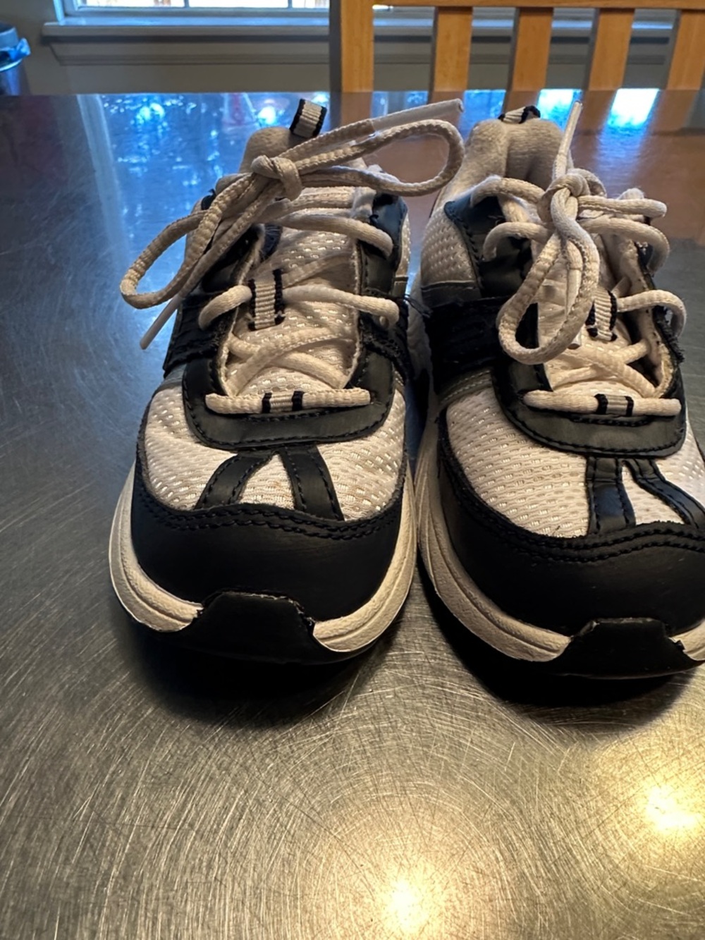 Nike Kids White and Black Athletic Sneakers with Blue Swoosh